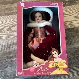 Disney Belle Porcelain Doll with Red and Pink Cape. Broken foot.